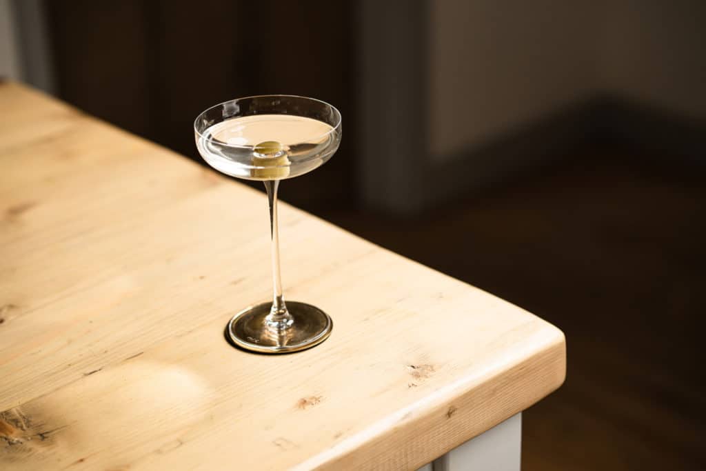 A classic martini or dirty martini recipe with an olive in the martini glass