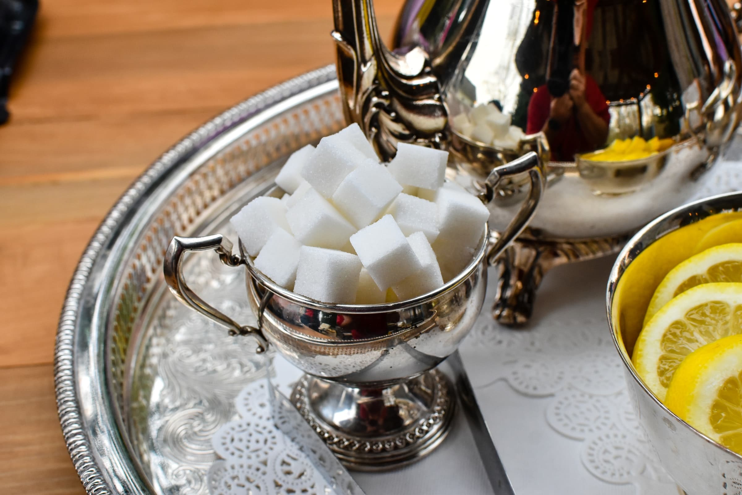 Sugar cubes in a dish on silver tray