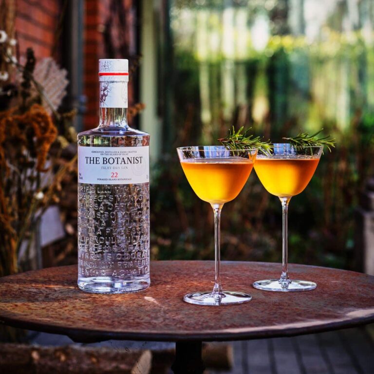Botanist Cocktails next to bottle of Botanist Gin at London Cocktail Week