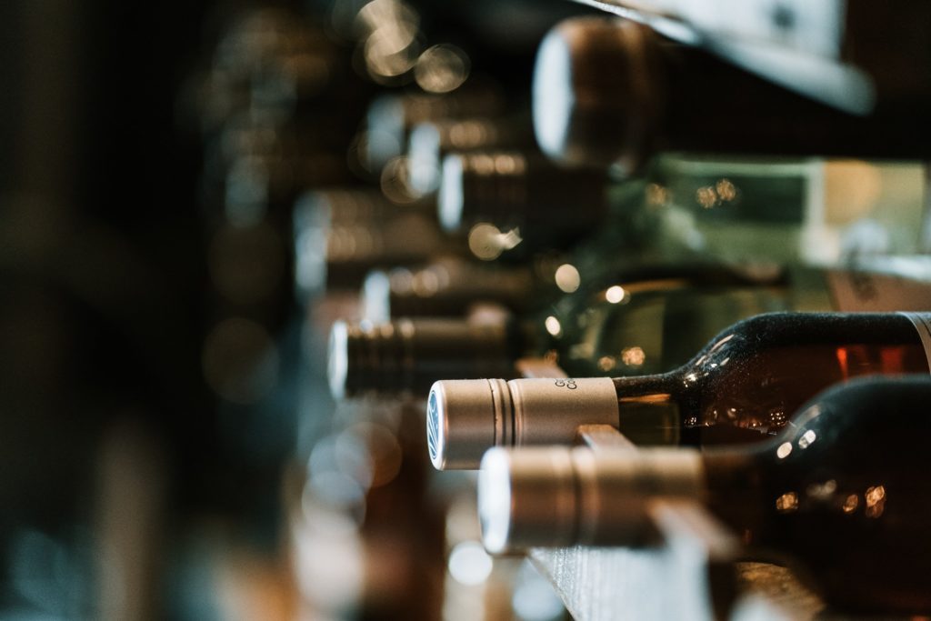 Alcohol bottles on a wine rack