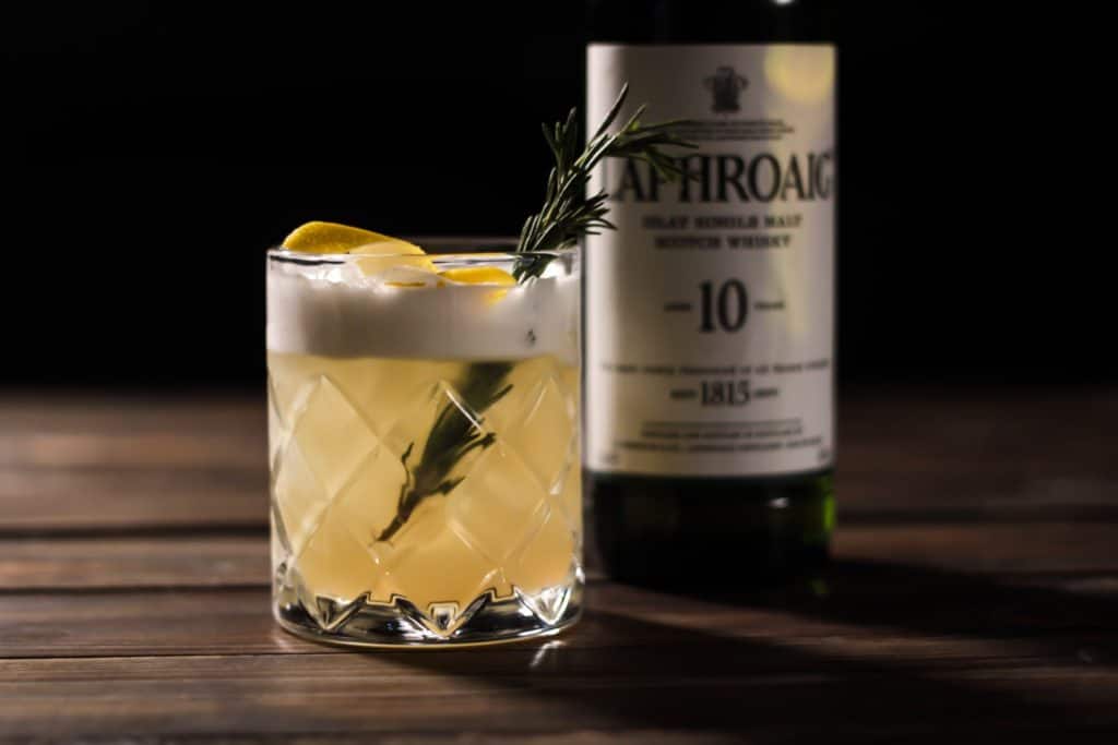 The Whisky Sour, a Whisky Cocktail for Burns Night with a bottle of Laphroaig Single Malt Scotch Whisky