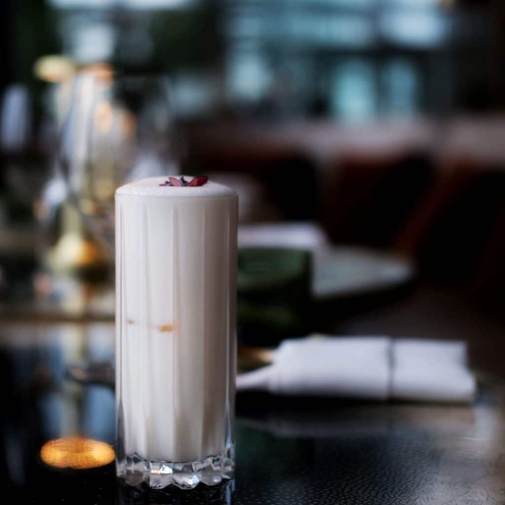 Aquafaba Gin Fizz, which uses aquafaba as a method of creating foam in vegan cocktails without egg whites