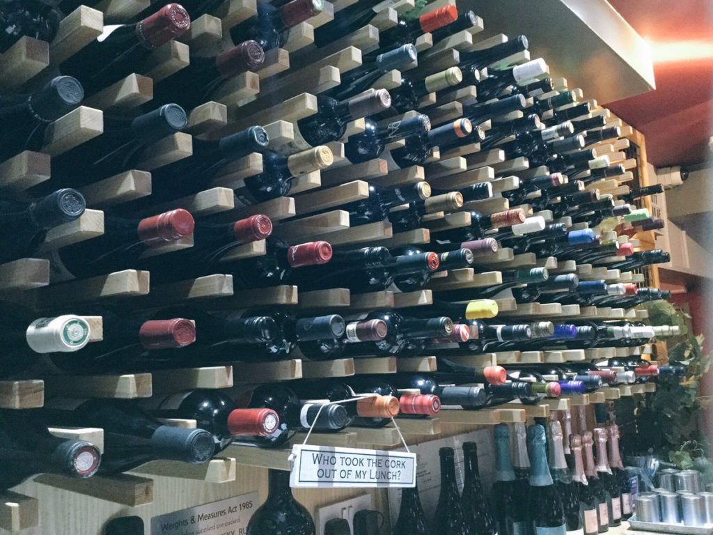 Wine rack at The Grape Escape, one of the best bars in Cheltenham for wine