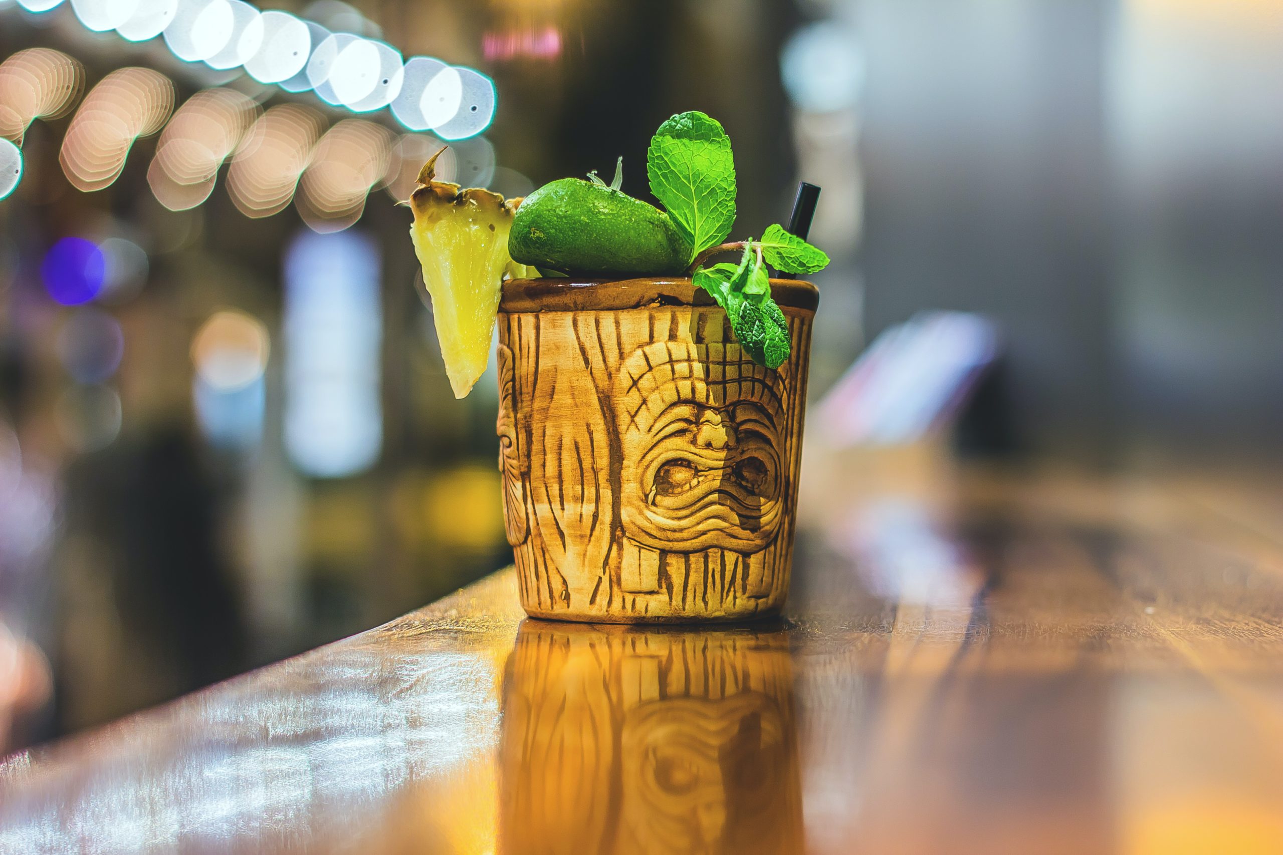 A cocktail in a tiki cocktail jar